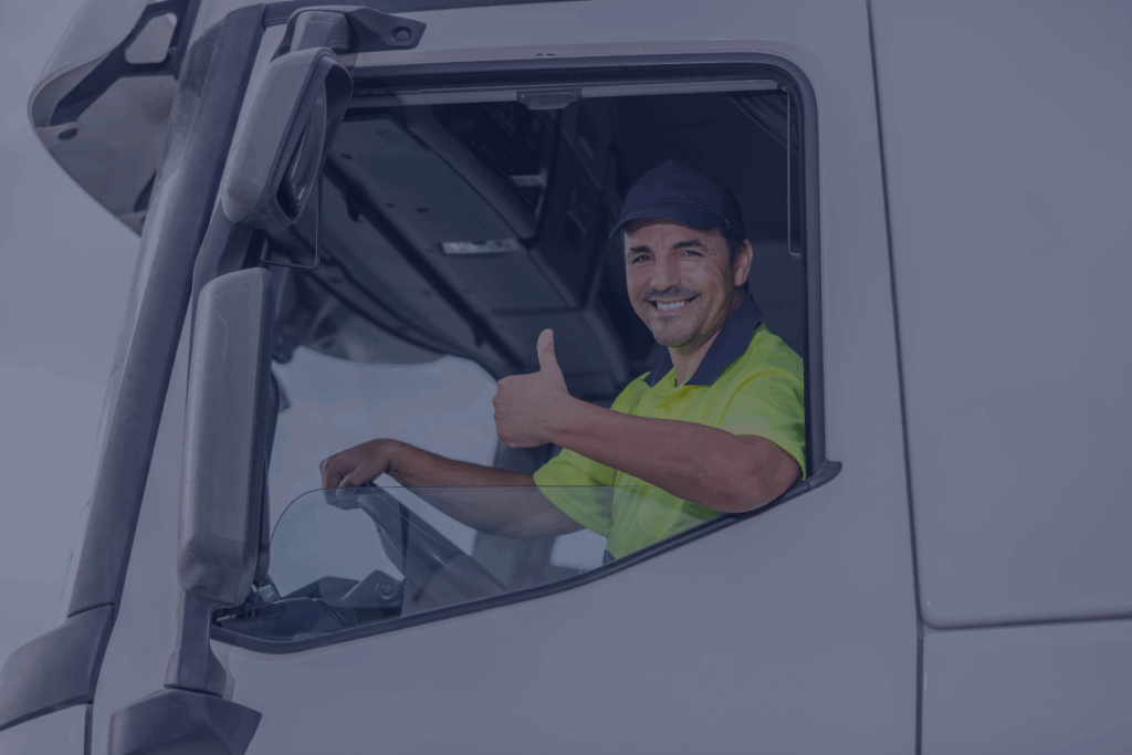 man giving thumbs up in truck